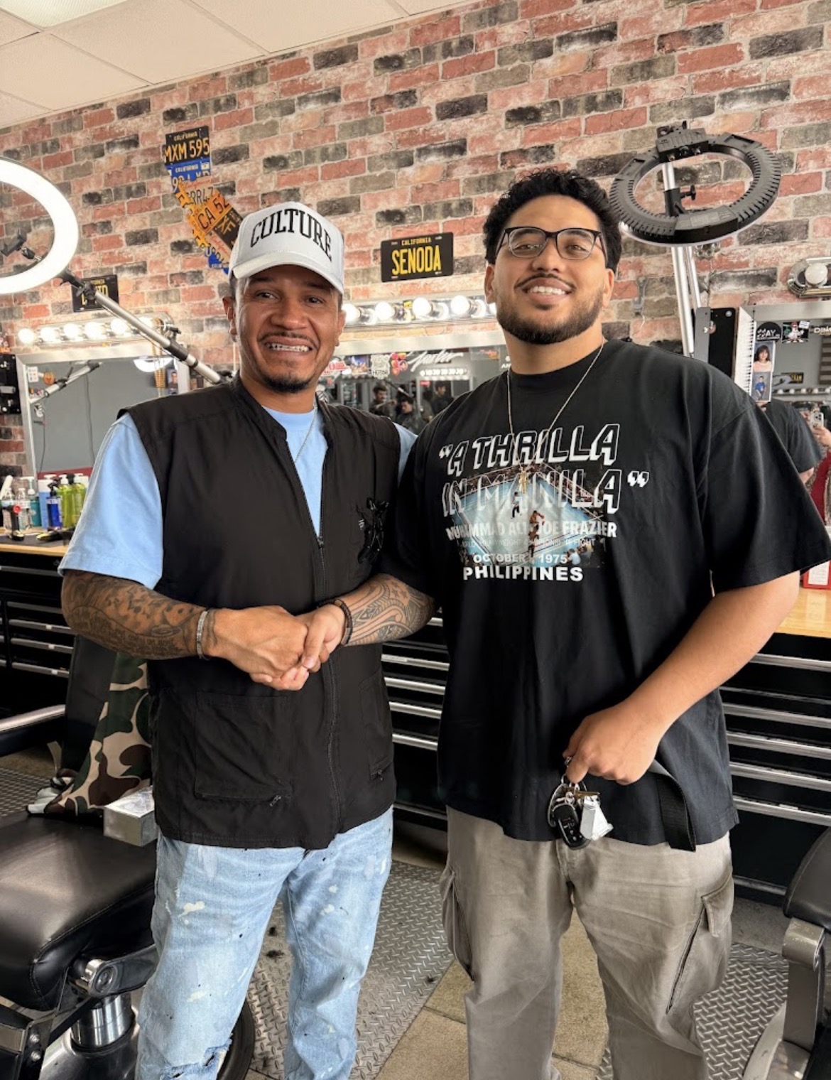 Barber and client at the shop